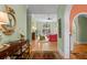 Open-concept living room with hardwood floors and large windows at 2515 Cat Tail Pond Rd, Seabrook Island, SC 29455