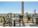 Outdoor dining area with picturesque ocean views, perfect for enjoying meals in a serene setting at 2515 Cat Tail Pond Rd, Seabrook Island, SC 29455