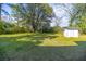 Lush green backyard showcasing mature trees, providing shade and tranquility to this property at 2604 Highway 78, Dorchester, SC 29437