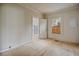Image shows bedroom with uninstalled floors, natural light, and an attached washroom at 2604 Highway 78, Dorchester, SC 29437