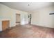 A largely empty bedroom with hardwood floors and doorway leading to another room at 2604 Highway 78, Dorchester, SC 29437