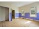 A bedroom with multiple doorways to other rooms, natural light, and outdated design at 2604 Highway 78, Dorchester, SC 29437