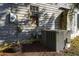 Exterior view of a home featuring an electrical box, AC unit, and boarded up window at 2604 Highway 78, Dorchester, SC 29437
