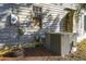 Exterior view of a home featuring an electrical box, AC unit, and boarded up window at 2604 Highway 78, Dorchester, SC 29437