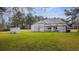 Expansive front yard featuring lush green grass and a vintage home with a separate storage building at 2604 Highway 78, Dorchester, SC 29437