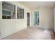 A room with paneled walls that features doorways to other rooms and a small rug at 2604 Highway 78, Dorchester, SC 29437