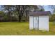 Exterior view of a shed featuring an old door on a property with grass and trees at 2604 Highway 78, Dorchester, SC 29437