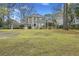 Rear exterior of home with back deck and landscaped yard at 2606 Marsh Creek Dr, Charleston, SC 29414