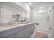 Bathroom featuring double vanity, marble countertop, and tiled walk-in shower at 2620 Private Lefler Dr, Johns Island, SC 29455