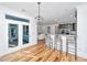 An open kitchen featuring bar seating, stainless steel appliances, and a view into another room at 2621 Ringsted Ln, Mount Pleasant, SC 29466