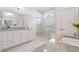 Modern bathroom with white cabinets, granite countertops, and walk-in shower with window at 2901 Eddy Dr, Mount Pleasant, SC 29466
