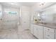 Bright bathroom featuring a glass-enclosed shower, white cabinets, and a neutral color palette at 2901 Eddy Dr, Mount Pleasant, SC 29466