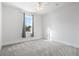 Bedroom with neutral carpet, white walls, base trim and a window providing natural light to the space at 2901 Eddy Dr, Mount Pleasant, SC 29466