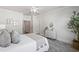 Cozy bedroom featuring a ceiling fan, a large window, and neutral decor at 2901 Eddy Dr, Mount Pleasant, SC 29466