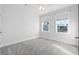 Bright bedroom featuring plush carpet, white walls, and natural light streaming through two large windows at 2901 Eddy Dr, Mount Pleasant, SC 29466