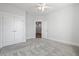 Spacious bedroom featuring neutral carpet, a ceiling fan, and a large closet with double doors at 2901 Eddy Dr, Mount Pleasant, SC 29466