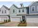 Charming townhome featuring colorful siding, a one-car garage, and manicured landscaping at 2901 Eddy Dr, Mount Pleasant, SC 29466