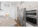 Modern kitchen with stainless steel appliances, double oven, and walk-in pantry access at 2901 Eddy Dr, Mount Pleasant, SC 29466
