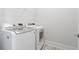 Laundry room featuring white washer and dryer units plus a wire storage shelf at 2901 Eddy Dr, Mount Pleasant, SC 29466