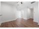 Bright living room with wood floors, white walls, ceiling fan, and access to hallway and doorway at 2901 Eddy Dr, Mount Pleasant, SC 29466