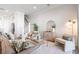 Cozy living room with comfortable seating, staircase, light decor, and ample natural light at 2901 Eddy Dr, Mount Pleasant, SC 29466