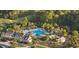 Aerial view of a pool and clubhouse nestled among mature trees in a beautiful residential community at 2901 Eddy Dr, Mount Pleasant, SC 29466