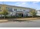 Exterior view of multi-Gathering residential building with multiple screened in porches and manicured landscaping at 2901 Eddy Dr, Mount Pleasant, SC 29466