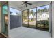 Screened porch featuring concrete flooring, ceiling fan, and neighborhood views at 2901 Eddy Dr, Mount Pleasant, SC 29466