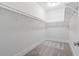 Clean walk-in closet with white shelving and neutral carpeting at 2901 Eddy Dr, Mount Pleasant, SC 29466