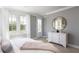 Cozy bedroom with natural light, neutral decor, and comfortable furnishings at 295 Citrus Dr, Summerville, SC 29486