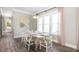 Bright dining room featuring a rustic wood table, stylish chairs, and lots of natural light at 295 Citrus Dr, Summerville, SC 29486