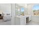 Bright bathroom with double vanity, large mirror, and a view to the bedroom at 297 Citrus Dr, Summerville, SC 29486