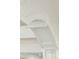 Close up detail of the intricate white arched columns in the home's interior at 3 Cross Ln, Isle of Palms, SC 29451