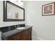 Cozy bathroom features a granite countertop vanity with a mirror and soft lighting at 3 Cross Ln, Isle of Palms, SC 29451
