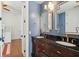 Stylish bathroom boasts dual sinks, elegant mirrors, and modern lighting fixtures at 3 Cross Ln, Isle of Palms, SC 29451