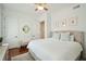 Inviting bedroom with hardwood floors, neutral decor, and soft natural lighting at 3 Cross Ln, Isle of Palms, SC 29451