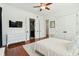 Comfortable bedroom featuring hardwood floors, ensuite bathroom, and closet space at 3 Cross Ln, Isle of Palms, SC 29451