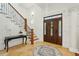 Inviting foyer with a decorative rug, grand front door, and staircase, creating a welcoming entrance at 3 Cross Ln, Isle of Palms, SC 29451