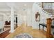 Bright and open foyer featuring beautiful tile flooring, elegant columns, and a staircase at 3 Cross Ln, Isle of Palms, SC 29451