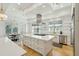 Bright, modern kitchen with a large island, stainless steel appliances, and custom cabinetry at 3 Cross Ln, Isle of Palms, SC 29451