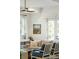 Sunlit living room featuring neutral colored sofas, stylish decor, a ceiling fan, and bright, natural light at 3 Cross Ln, Isle of Palms, SC 29451