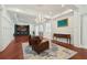 Spacious living room featuring hardwood floors, elegant chandelier, and classic furnishings at 3 Cross Ln, Isle of Palms, SC 29451