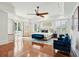 Spacious main bedroom with tray ceiling, hardwood floors, and access to a private balcony at 3 Cross Ln, Isle of Palms, SC 29451