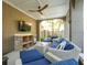 Relaxing outdoor lounge featuring a wicker sofa, a ceiling fan, and a TV at 3 Cross Ln, Isle of Palms, SC 29451