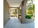 Covered walkway featuring an arched column design and landscaped flowerbeds at 3 Cross Ln, Isle of Palms, SC 29451