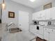 Well-lit kitchen featuring stainless steel appliances, white cabinetry, and ample counter space at 300 Bucksley Ln # 104, Charleston, SC 29492