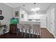 Contemporary kitchen boasts white cabinets, stainless steel appliances, and a convenient breakfast bar with stool seating at 300 Bucksley Ln # 104, Charleston, SC 29492