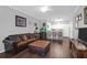 Cozy living room with open-concept design, hardwood floors, and a modern ceiling fan at 300 Bucksley Ln # 104, Charleston, SC 29492
