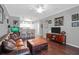 Inviting living room featuring hardwood floors, plush leather seating, and stylish decor at 300 Bucksley Ln # 104, Charleston, SC 29492