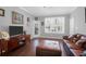 Sun-filled living room showcasing hardwood floors, plantation shutters, and stylish decor at 300 Bucksley Ln # 104, Charleston, SC 29492